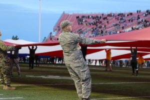 American soliders holding the flag at the 2019 Las Vegas Bowl