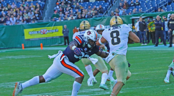 K.J. Britt making a tackle in the 2018 Music City Bowl