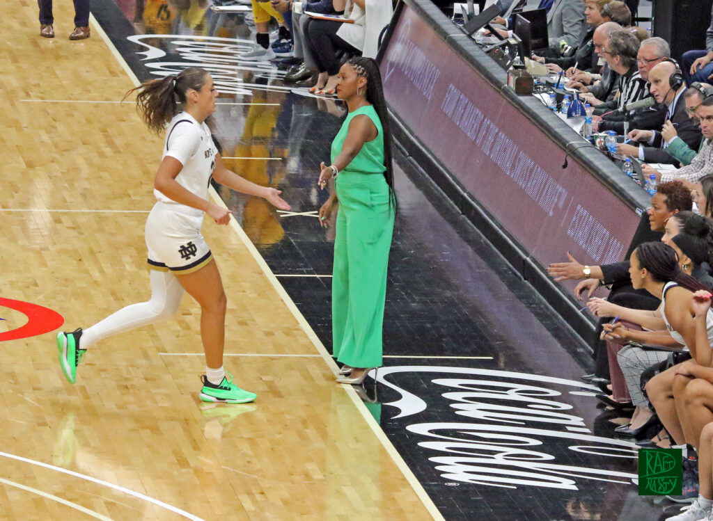 Notre Dame HC Niele Ivey giving a hand to 2021 ACC Freshman of the Year Maddy Westbeld