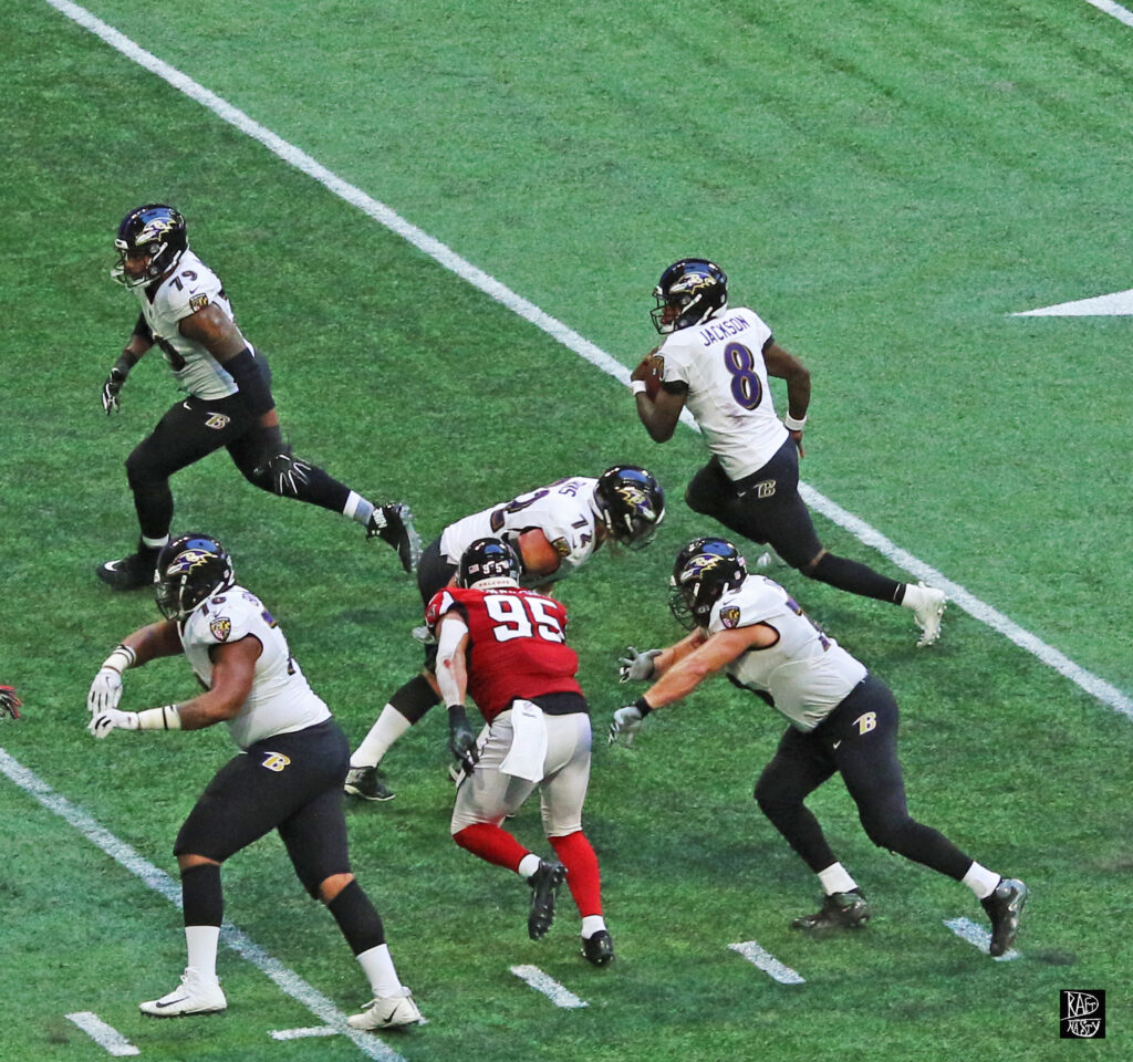 Lamar Jackson running with the football against the Atlanta Falcons in 2018.