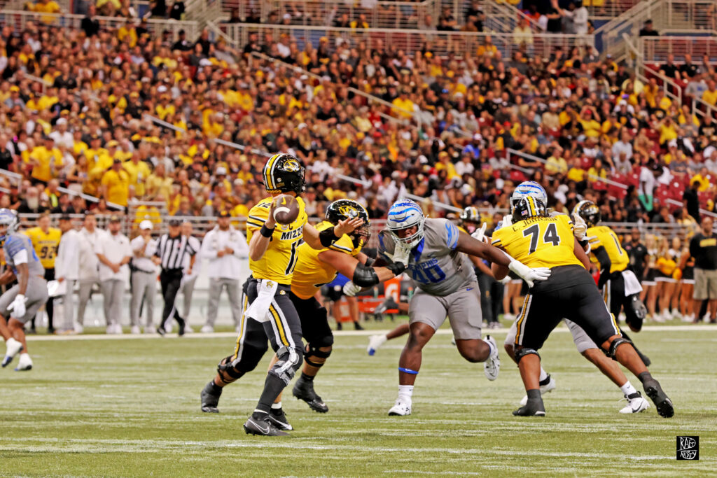 Missouri quarterback Brady Cook throws a touchdown versus Memphis
