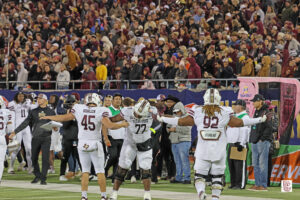 John Oehrlein, and Chayse Todd celebrate in the fourth quarter of Texas State's bowl win