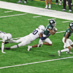 Penn State DE Adisa Isaac makes the tackle on Michigan State's Montorie Foster, Jr.
